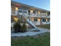 Exterior of a two-story building featuring walkways and staircases at 5940 21St N St # 11, St Petersburg, FL 33714
