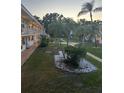 Exterior courtyard featuring green space and trees at 5940 21St N St # 11, St Petersburg, FL 33714