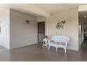 Charming covered front porch with a bench, perfect for relaxing at 6070 80Th N St # 308, St Petersburg, FL 33709