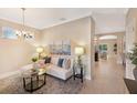 Inviting living space with comfortable seating, a decorative rug, and an open layout at 7410 S Fitzgerald St, Tampa, FL 33616