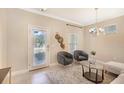 Bright living area featuring stylish furniture, neutral colors, and a cozy ambiance for relaxation at 7410 S Fitzgerald St, Tampa, FL 33616