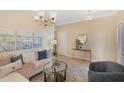 Cozy living room showcasing a plush sofa, decorative pillows, and plenty of natural light at 7410 S Fitzgerald St, Tampa, FL 33616