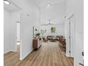 Bright living room with wood floors flows into the dining area with sliding glass door at 7603 Rhode Island Dr, Tampa, FL 33619