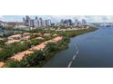 Stunning aerial view showcases waterfront property with a cityscape backdrop at 1117 Shipwatch Cir, Tampa, FL 33602