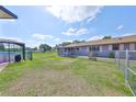 Spacious backyard with a screened lanai pool, perfect for outdoor living and entertainment at 13208 Sydney Rd, Dover, FL 33527