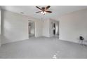 Open living room featuring modern ceiling fan and neutral color palette at 1665 Laura St, Clearwater, FL 33755
