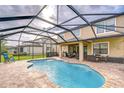 Inviting screened-in pool area with outdoor seating and dining at 19533 Whispering Brook Dr, Tampa, FL 33647