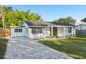 Charming single-story home featuring a freshly painted exterior and a well-manicured lawn at 2288 Cheryl Rd, Largo, FL 33771