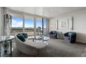 Bright living room with a large sliding glass door opening to a balcony with city views at 30 Turner St # 604, Clearwater, FL 33756