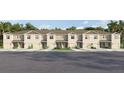 Charming townhome exterior in neutral color with a well-kept lawn and individual garages, ideal for modern living at 3643 Copper Beech Dr, Land O Lakes, FL 34638