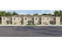 Well-maintained townhome exterior featuring a manicured lawn, neutral color scheme, and single-car garages at 3643 Copper Beech Dr, Land O Lakes, FL 34638