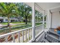 Inviting front porch view showcasing the neighborhood with a cozy seating area and charming curb appeal at 3709 W Santiago St, Tampa, FL 33629