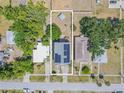 Aerial view of the property showcasing the house, yard, and surrounding neighborhood at 503 Chestnut St, Oldsmar, FL 34677