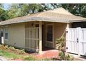 Charming home exterior featuring a private courtyard and a cozy, welcoming entryway at 7205 San Luis Ct, Tampa, FL 33634