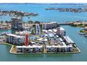 Aerial view showcasing the waterfront condominium complex with its prime waterfront location at 7910 Sun Island S Dr # 203, South Pasadena, FL 33707