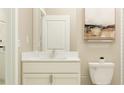 Bright bathroom showcasing a sleek vanity with quartz countertop, modern faucet, and tasteful decor for a clean and welcoming space at 9590 Runaway Breeze Dr, Land O Lakes, FL 34637