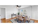 Cozy dining area with wainscotting and a large window at 1402 Freemont S St, Gulfport, FL 33707