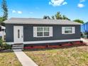 Beautiful home featuring new siding, a stylish front door, and updated landscaping in a great location at 1402 Freemont S St, Gulfport, FL 33707