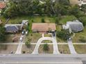 An aerial view shows a residential property with a distinctive driveway and well-maintained landscaping at 1710 26Th S Ave, St Petersburg, FL 33712