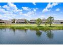 Backyards of beautiful homes facing the lake with views of the waterway at 1830 Nature View Dr, Lutz, FL 33558