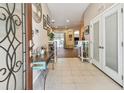 Inviting entryway with tile flooring, white trim, and lots of natural light at 1939 Heartland Cir, Valrico, FL 33594