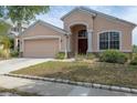 Well-maintained single-Gathering home with two-car garage and inviting front entrance at 416 Durham Shore Ct, Apollo Beach, FL 33572