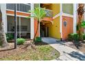 Entrance to building with nicely landscaped grounds, sidewalks, and the building number prominently displayed at 4207 S Dale Mabry Hwy # 12206, Tampa, FL 33611
