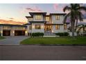 Imposing two-story home with modern design elements and lush landscaping at 4300 Bayshore Ne Blvd, St Petersburg, FL 33703