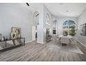 Bright dining room with high ceilings, modern decor, and lots of natural light at 4761 Stoneview Cir, Oldsmar, FL 34677