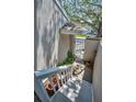 Charming gated entrance featuring a secure entry leading to a cozy home with lush greenery and peaceful surroundings at 5115 S Jules Verne Ct, Tampa, FL 33611