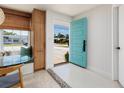 Bright entryway with a stylish front door and unique tile flooring detail at 9301 Sun Isle Ne Dr, St Petersburg, FL 33702
