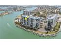 Luxury waterfront condo building with boat docks and resort-style amenities at 9495 Blind Pass Rd # 907, St Pete Beach, FL 33706