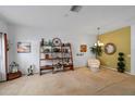 Living room featuring tasteful decorations, neutral colors, and plush carpeting at 12805 Kings Crossing Dr, Gibsonton, FL 33534