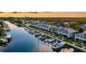 Stunning aerial view of waterfront homes with private docks and boats, nestled along a tranquil canal at 1625 Watermark Ne Cir, St Petersburg, FL 33702