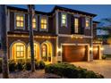 Charming two-story home showcasing a welcoming front door and manicured landscaping, highlighting curb appeal at 4419 Ortona Ln, Wesley Chapel, FL 33543