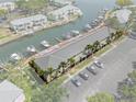 Aerial view of waterfront condo highlighted with red border, boat docks, canal, and parking lot at 5174 Beach Se Dr # B, St Petersburg, FL 33705