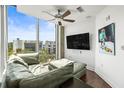 Modern living room with expansive windows offering city views and designer touches at 777 N Ashley Dr # 402, Tampa, FL 33602