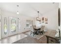Bright dining room with modern light fixture and neutral decor at 11165 Little Gull Rd, Weeki Wachee, FL 34614