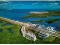 Breathtaking aerial view showcasing waterfront condos, a marina, and easy access to the city at 12033 Gandy N Blvd # 131, St Petersburg, FL 33702