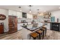 Stunning kitchen with a large island with seating, unique refrigerator, updated appliances, and stylish accents at 3515 Bell Farms Dr, Plant City, FL 33566