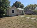 Street view of a single-story home with a small porch and walkway at 4420 6Th S Ave, St Petersburg, FL 33711