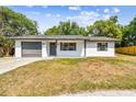 Charming single-story home with an attached one car garage and well-maintained lawn at 5628 Mccoy Ct, Zephyrhills, FL 33542