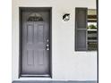 Close-up of the front door and window, highlighting the home's architecture at 5628 Mccoy Ct, Zephyrhills, FL 33542