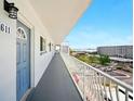 Condominium balcony with railing and a stunning view of the city at 5925 Shore S Blvd # 611, Gulfport, FL 33707