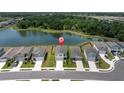 Aerial view of neighborhood homes with large lake at 7721 Twin Leaf Ter, Parrish, FL 34219