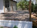 Exterior wooden deck, with access to the house and a view of the surrounding greenery at 8255 Richmond St, Gibsonton, FL 33534
