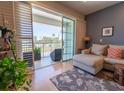 Bright living room featuring a balcony with sliding glass doors and neutral-toned sectional sofa at 8304 Aquila St, Port Richey, FL 34668
