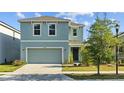 Beautiful two-story home with a well-maintained lawn and inviting curb appeal at 10940 Trailing Vine Dr, Tampa, FL 33610