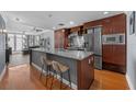 Modern kitchen featuring a large island, stainless steel appliances, and ample storage at 1120 E Kennedy Blvd # 1228, Tampa, FL 33602