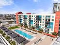 A beautiful rooftop condo pool with lounge chairs and city views at 1120 E Kennedy Blvd # 1228, Tampa, FL 33602